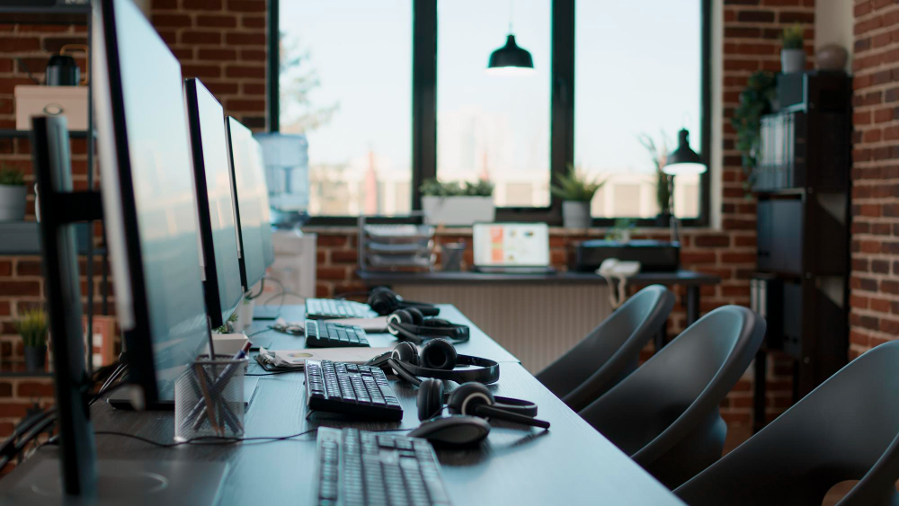 no-people-desk-with-multiple-computers-call-center-office-used-by-telemarketing-agents-answer-phone-calls-helpline-empty-space-with-technology-give-assistance-customer-care